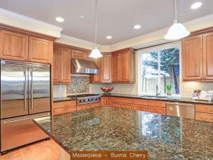 A remodeled kitchen with granite countertops, stainless steel appliances, and wood cabinets.