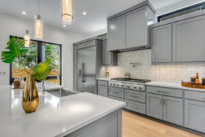 Large kitchen with island and grey cabinetry