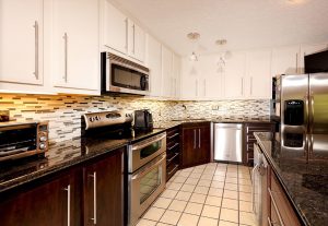 Renovated kitchen with tile floors and white cabinetsKitchen Restyling & Cabinet Refacing Hampton, VA