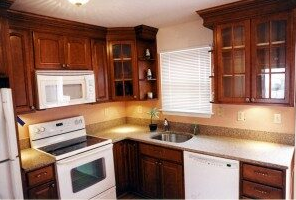 A fully furnished modular kitchen with new wood cabinets 